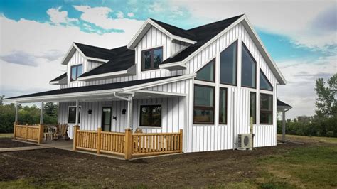 white and black metal house|homes with metal siding photos.